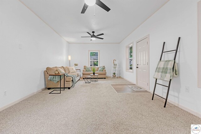 1803 S Quincy Ave, Sedalia, MO 65301 - carpeted living room featuring ceiling fan and baseboards