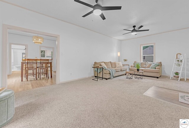 1803 S Quincy Ave, Sedalia, MO 65301 - living room featuring carpet flooring, a ceiling fan, and baseboards