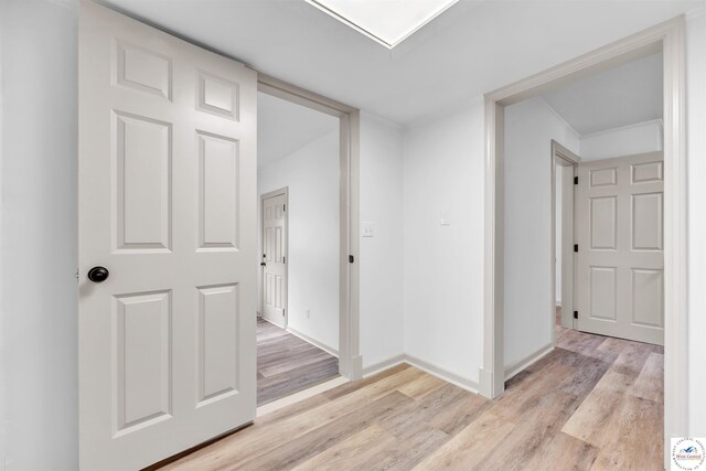 1803 S Quincy Ave, Sedalia, MO 65301 - corridor featuring light wood-style floors and baseboards