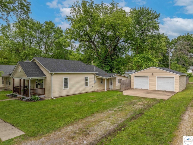 1803 S Quincy Ave, Sedalia, MO 65301 - ranch-style home featuring a porch, an outbuilding, a garage, and a front yard