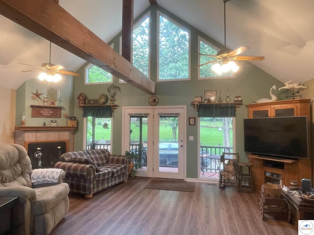791 SE 1211th Rd, Deepwater, MO 64740 - living room featuring ceiling fan, high vaulted ceiling, a tiled fireplace, wood finished floors, and beam ceiling