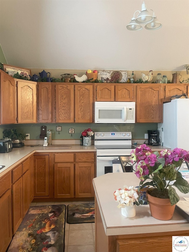 791 SE 1211th Rd, Deepwater, MO 64740 - kitchen featuring white appliances, light countertops, brown cabinets, light tile patterned floors, and decorative light fixtures
