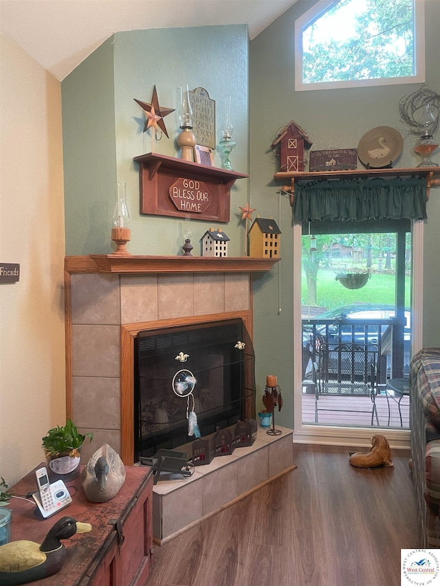791 SE 1211th Rd, Deepwater, MO 64740 - living room featuring wood finished floors and a tile fireplace