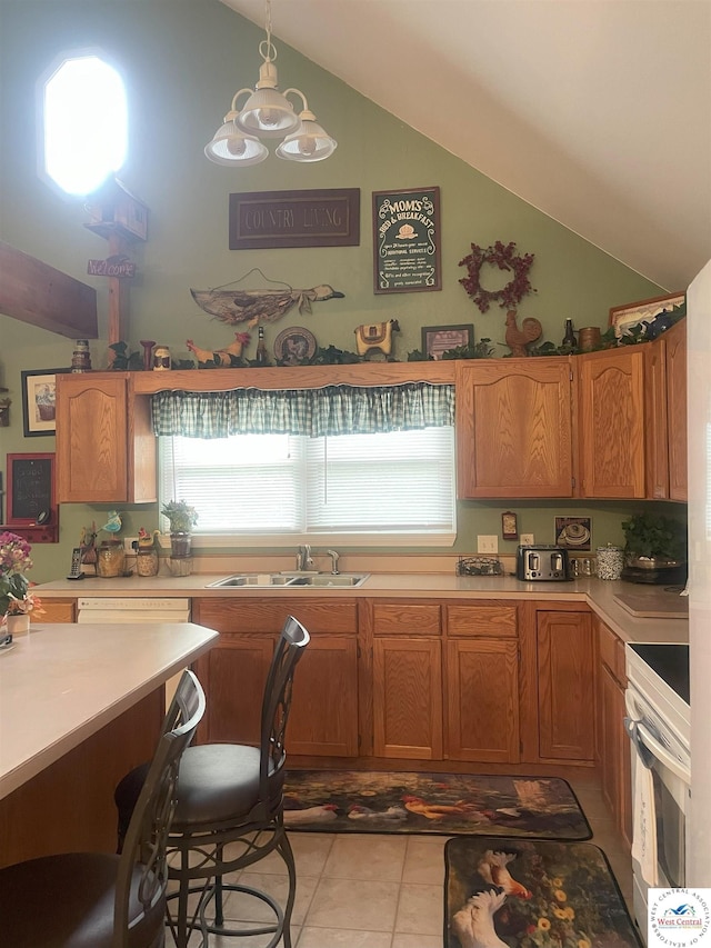 791 SE 1211th Rd, Deepwater, MO 64740 - kitchen with range, lofted ceiling, light countertops, light tile patterned floors, and brown cabinets