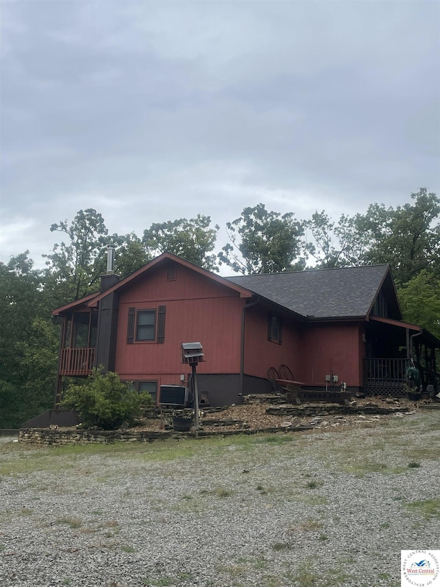 791 SE 1211th Rd, Deepwater, MO 64740 - view of property exterior with a sunroom