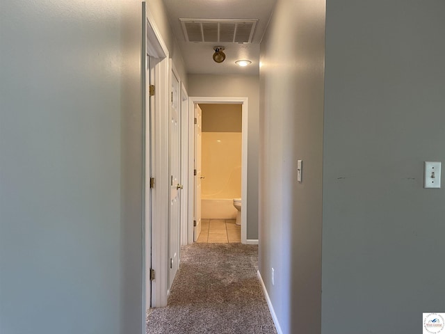 845 Ww Hwy, Osceola, MO 64776 - corridor with carpet flooring, attic access, and tile patterned floors