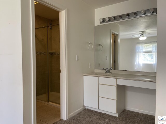 845 Ww Hwy, Osceola, MO 64776 - bathroom with a shower stall, baseboards, ceiling fan, and vanity
