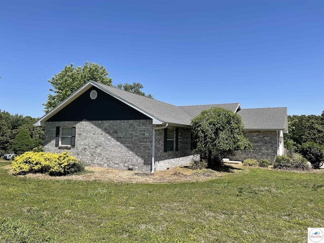 845 Ww Hwy, Osceola, MO 64776 - view of side of home with brick siding, a yard, and a shingled roof