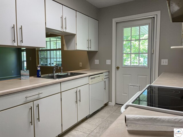 845 Ww Hwy, Osceola, MO 64776 - kitchen with white dishwasher, a sink, white cabinetry, and light countertops