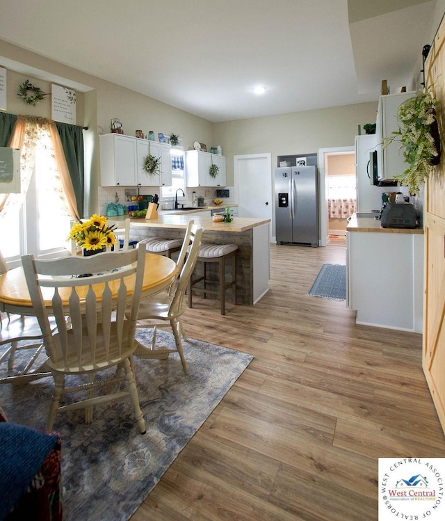 1625 W 16th St, Sedalia, MO 65301 - dining space with light wood-type flooring