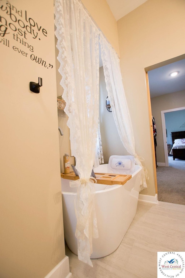 1625 W 16th St, Sedalia, MO 65301 - bathroom with a freestanding bath and baseboards