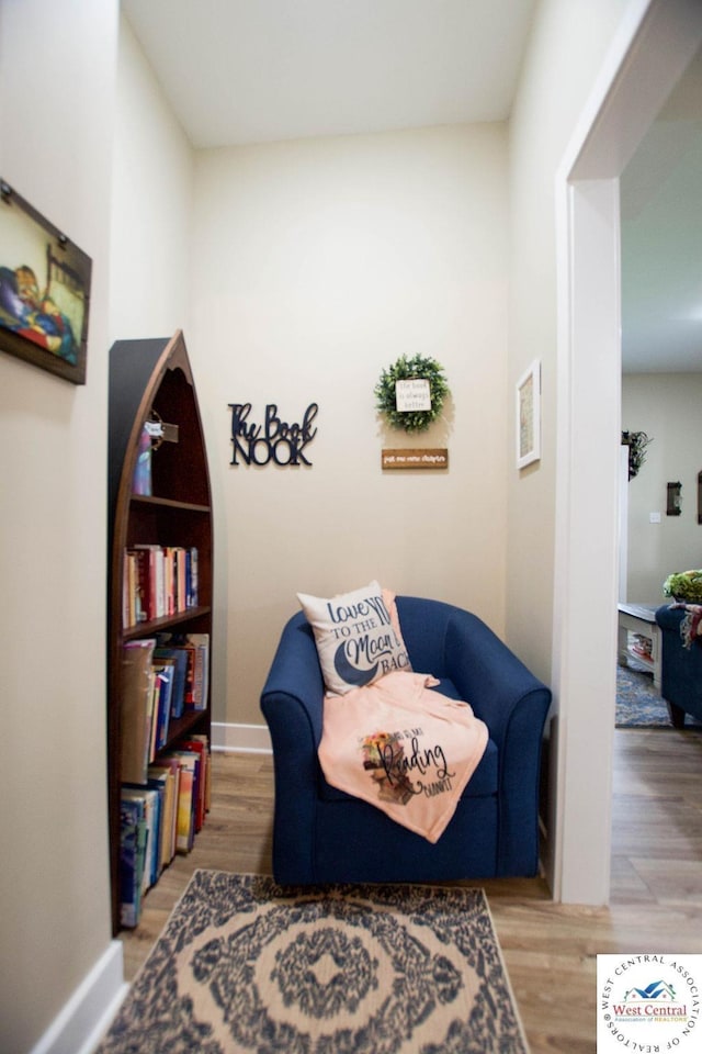 1625 W 16th St, Sedalia, MO 65301 - sitting room with wood finished floors and baseboards