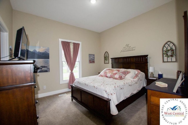 1625 W 16th St, Sedalia, MO 65301 - carpeted bedroom featuring baseboards