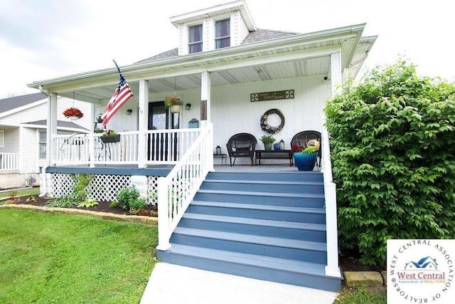 1625 W 16th St, Sedalia, MO 65301 - view of front of property featuring a porch and roof with shingles