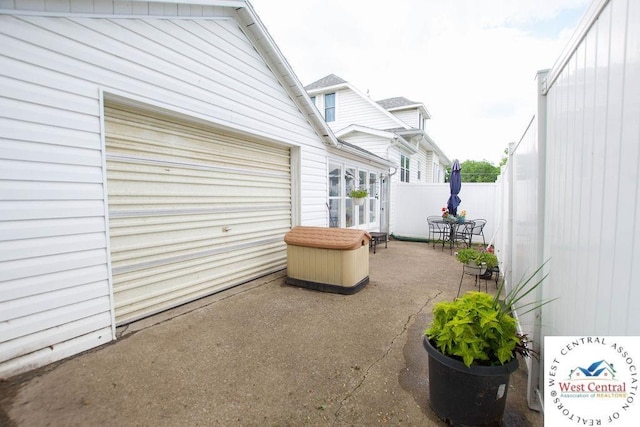 1625 W 16th St, Sedalia, MO 65301 - view of patio with a garage