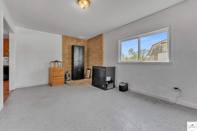 216 S County Line Rd, Windsor, MO 65360 - unfurnished bedroom featuring speckle patterned floor and baseboards