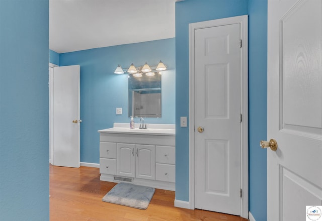 216 S County Line Rd, Windsor, MO 65360 - full bath featuring vanity, wood finished floors, a shower, and baseboards