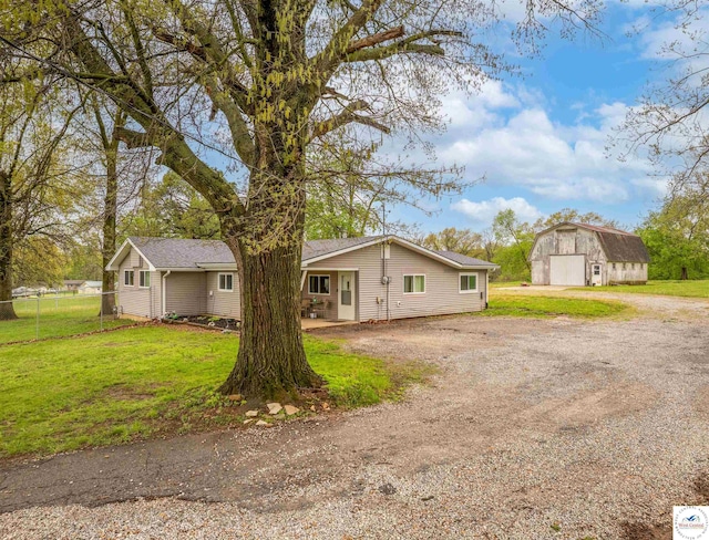 216 S County Line Rd, Windsor, MO 65360 - view of front of property with dirt driveway, an outdoor structure, and a garage