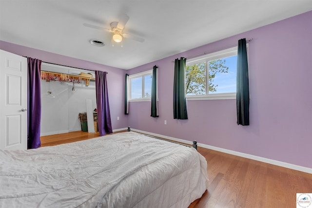 216 S County Line Rd, Windsor, MO 65360 - bedroom featuring wood finished floors, ceiling fan, and baseboards