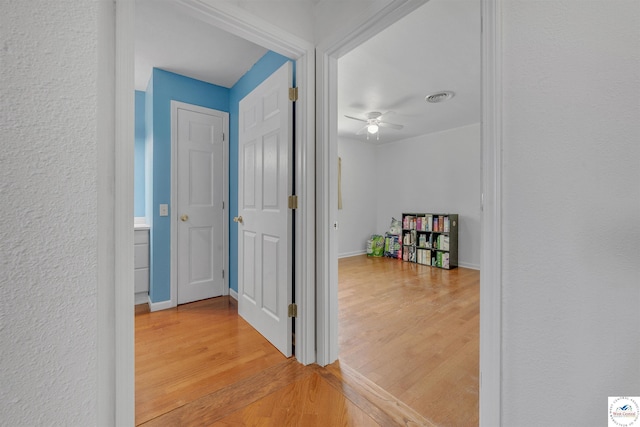 216 S County Line Rd, Windsor, MO 65360 - corridor with light wood finished floors and baseboards