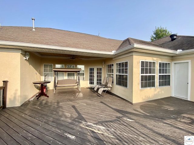 wooden terrace with french doors and ceiling fan