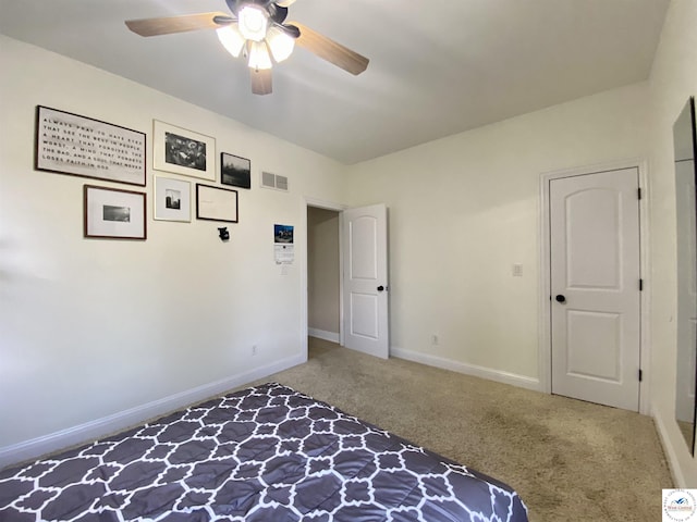 unfurnished bedroom with visible vents, baseboards, carpet flooring, and ceiling fan