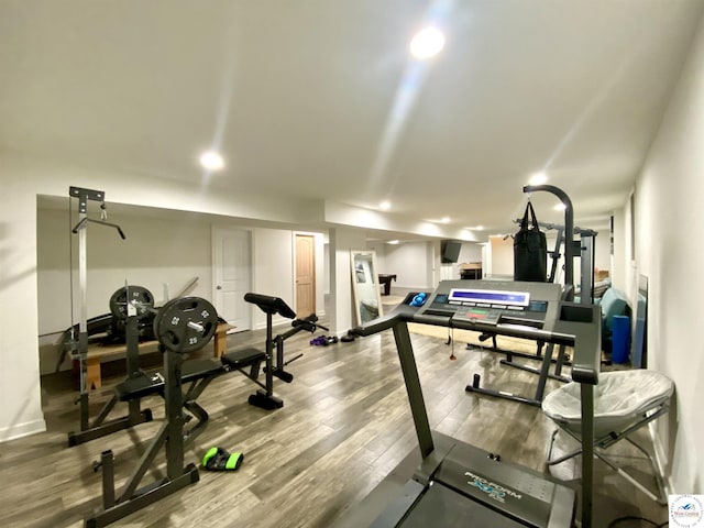 workout area featuring wood finished floors