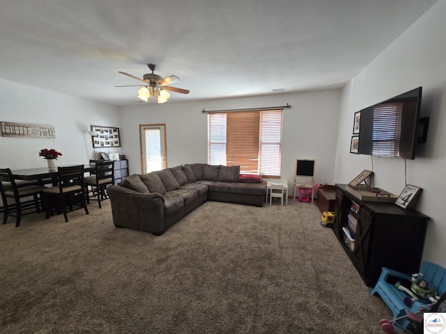 living room with ceiling fan and carpet flooring