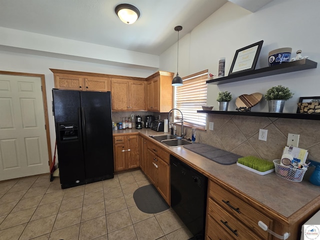 kitchen featuring tasteful backsplash, open shelves, brown cabinets, black appliances, and a sink