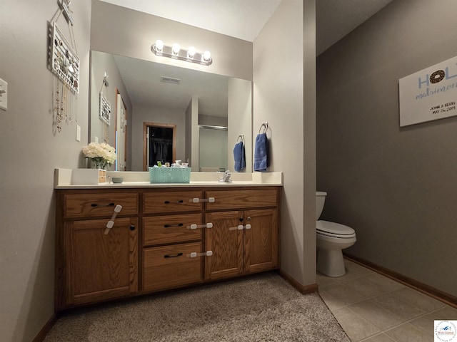 bathroom featuring a shower with shower door, toilet, vanity, baseboards, and visible vents