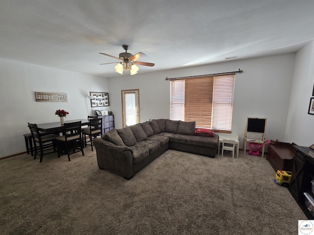 carpeted living room with a ceiling fan