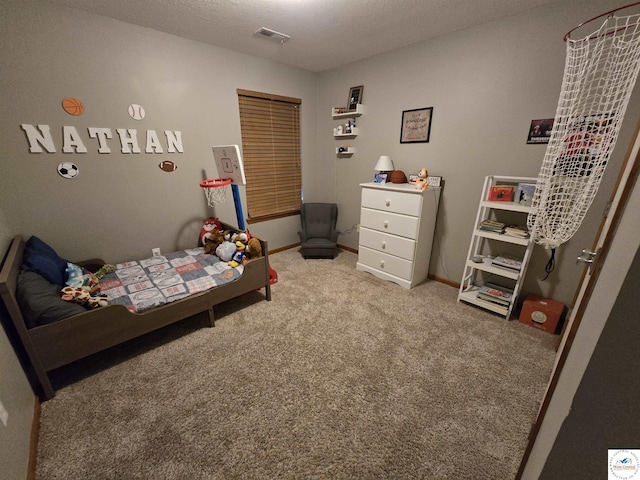 carpeted bedroom with baseboards and visible vents