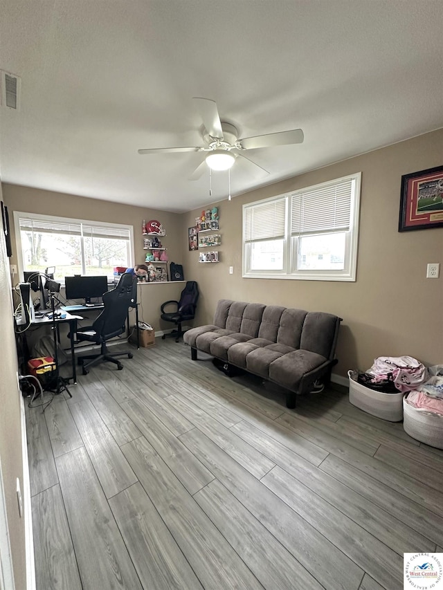 3001 Clarendon Rd, Sedalia, MO 65301 - living room featuring visible vents, wood finished floors, and a wealth of natural light
