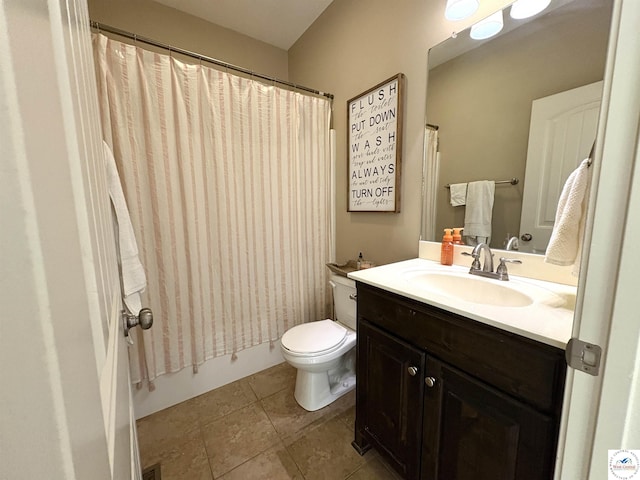 full bath with vanity, toilet, tile patterned floors, and shower / bath combo