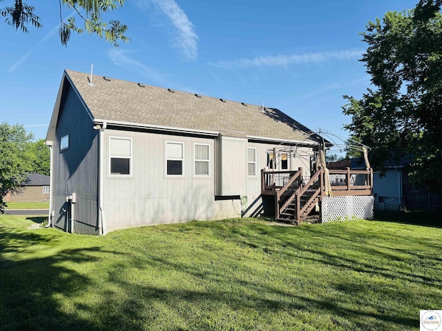 back of house with a wooden deck, a yard, stairway, and a shingled roof