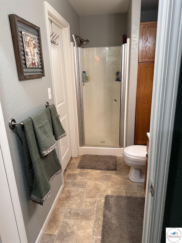 34443 Peters Ave, Warsaw, MO 65355 - bathroom with toilet, stone finish floor, and a shower stall