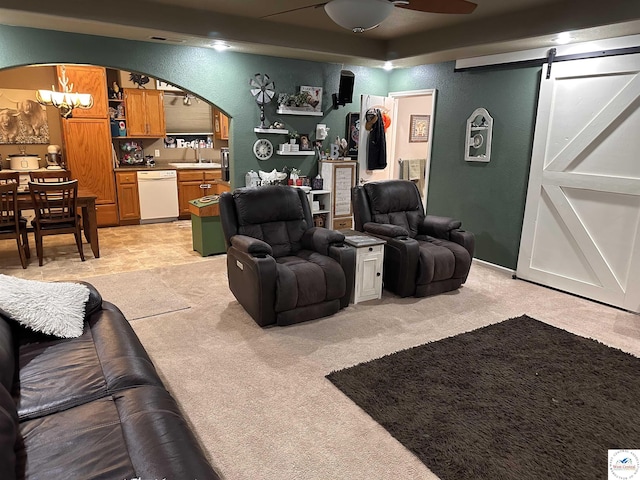 34443 Peters Ave, Warsaw, MO 65355 - living room with a barn door, arched walkways, light carpet, and ceiling fan
