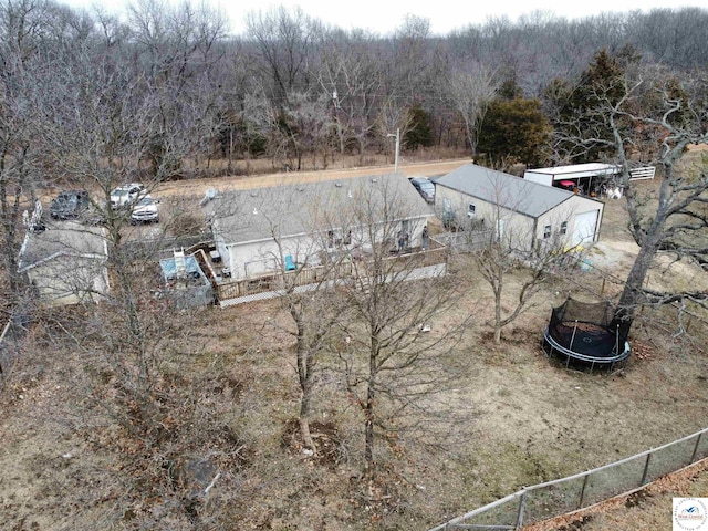 34443 Peters Ave, Warsaw, MO 65355 - exterior space with fence, a trampoline, and a view of trees