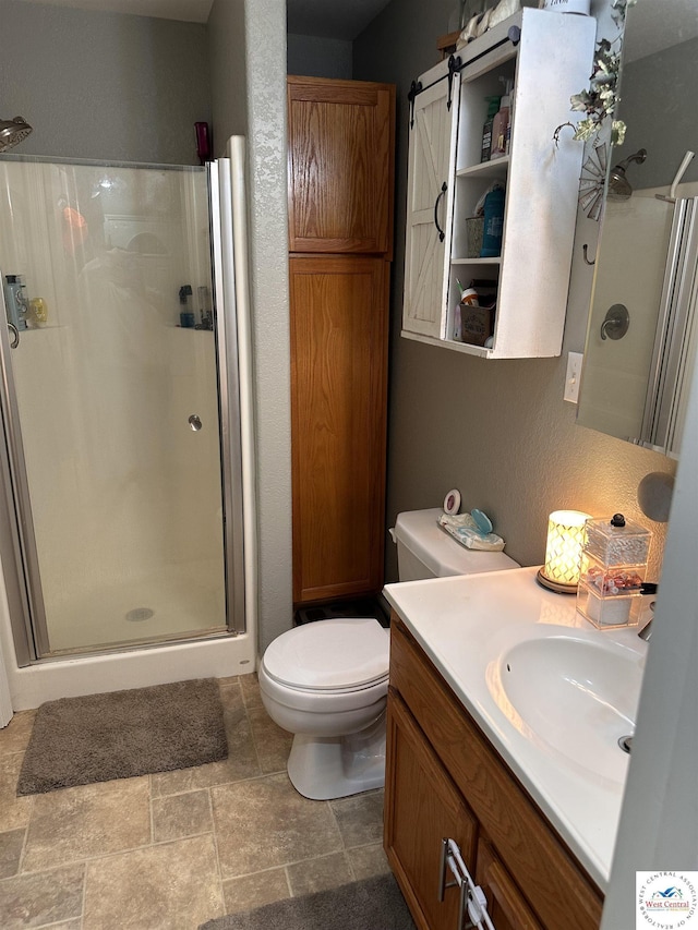 34443 Peters Ave, Warsaw, MO 65355 - bathroom with toilet, a shower stall, vanity, and stone finish flooring