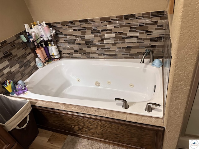 34443 Peters Ave, Warsaw, MO 65355 - bathroom with a tub with jets and a textured wall