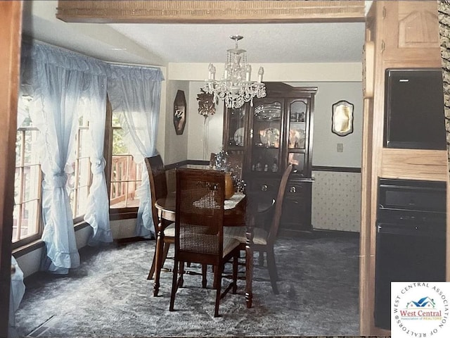 592 Woodland Dr, Climax Springs, MO 65324 - dining space featuring a chandelier and carpet flooring