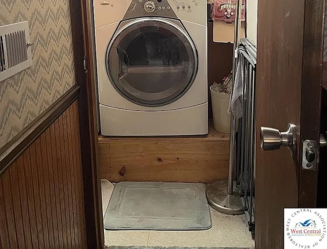 592 Woodland Dr, Climax Springs, MO 65324 - laundry room with washer / dryer and wallpapered walls