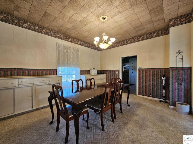 406 W Main St, Cole Camp, MO 65325 - dining area with a chandelier, carpet flooring, and a wainscoted wall