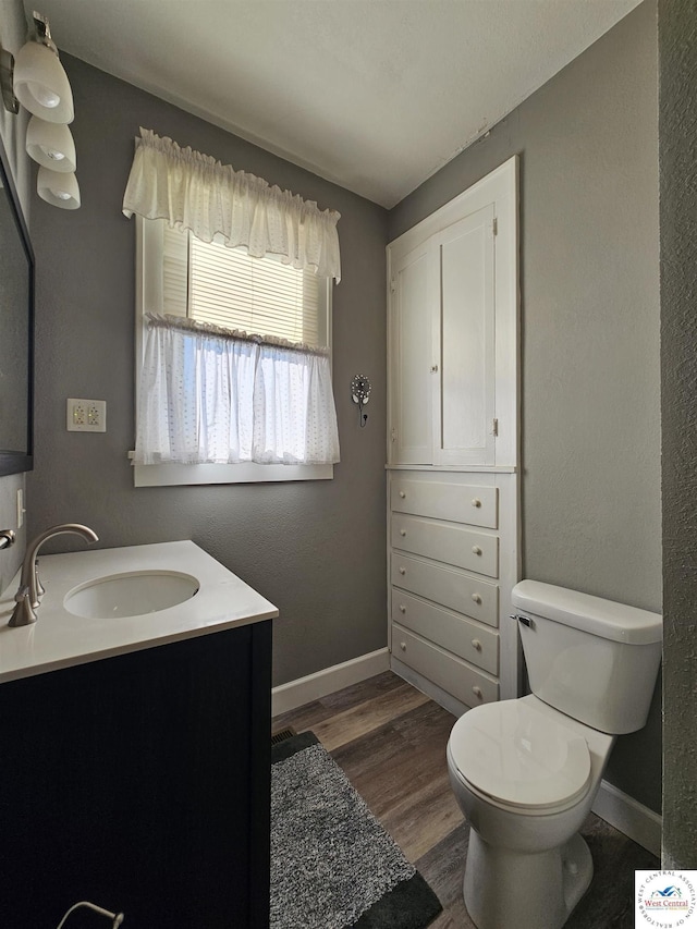 406 W Main St, Cole Camp, MO 65325 - bathroom with wood finished floors and vanity