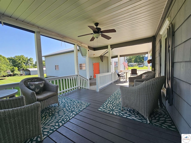 406 W Main St, Cole Camp, MO 65325 - wooden deck featuring a ceiling fan