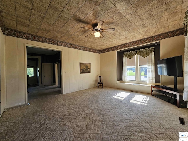 406 W Main St, Cole Camp, MO 65325 - unfurnished living room with carpet floors and a ceiling fan