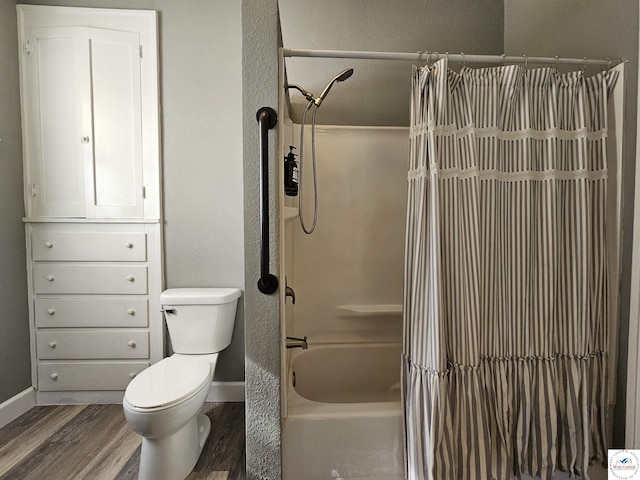406 W Main St, Cole Camp, MO 65325 - bathroom featuring wood finished floors and shower / tub combo