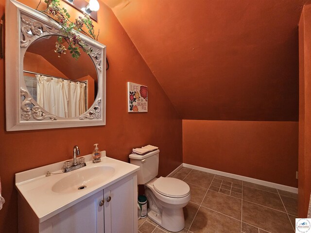 406 W Main St, Cole Camp, MO 65325 - full bath featuring vaulted ceiling, vanity, and tile patterned flooring