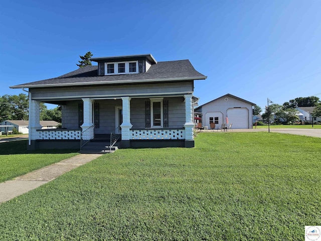 406 W Main St, Cole Camp, MO 65325 - view of front of property featuring a garage, a front lawn, covered porch, and driveway