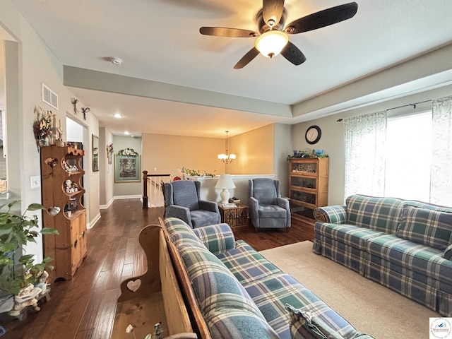 711 Katy Cir, Sedalia, MO 65301 - living room featuring dark wood-type flooring, a chandelier, a ceiling fan, and baseboards